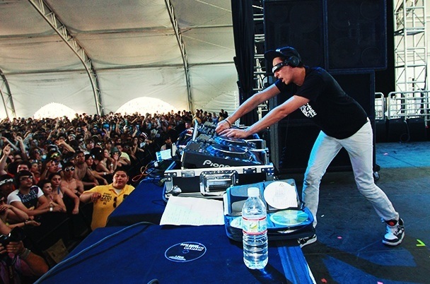 A DJ working the EQ
