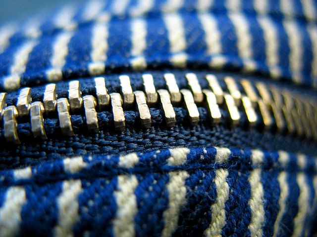 A macro shot of a zipper